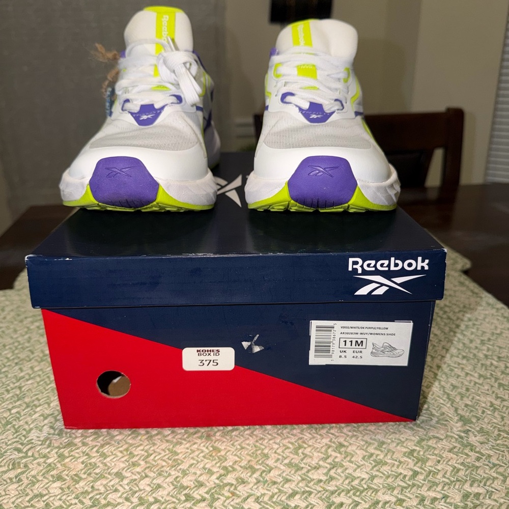 Reebok women’s Ionic Bond White Sneakers with Purple and Yellow Accents size 11!